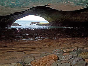 Arniston, named after the 1815 wreck with very heavy loss of life of the East Indiaman Arniston, is also know as Waenhuiskrans (Carriage house cliff) after this cave which is large enough to fit a wagon and its span of oxen.  Find Agulhas accommodation on our Agulhas accommodation page.