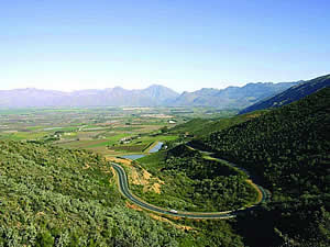 The Ceres valley from Mitchells Pass.  Fertile, with good rainfall and warm summers, Ceres is a major source of deciduous fruit, especially cherries, and is famous world-wide for its own exported brand of fruit juices.  Find Ceres accommodation on our Ceres accommodation page.