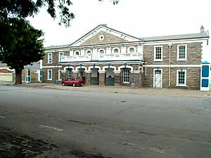 The drill hall of the First City Regiment, raised in 1875 from volunteers in the city.  Grahamstown was the principal military base during the earlier Frontier Wars involving the British and the Xhosa and was itself once heavily attacked.  The regiment has accumulated 18 battle honours. Find Grahamstown accommodation on our Grahamstown accommodation page.