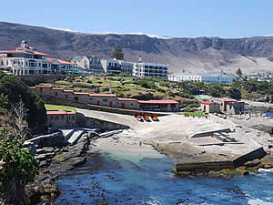Hermanus, the old harbour.  Hermanus is a village squeezed between the sea and the mountains, creating a scenic location that has charmed visitors since its founding.  The village has grown hugely since then but has managed to retain its atmosphere.  Find Hermanus accommodation on our Hermanus accommodation page.