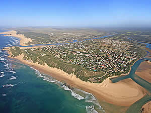 Kenton-on-Sea is a holiday village situated between two rivers, the Bushmans (the far side) and the Kariega (the near side), with a proclaimed nature reserve in between.  The area boasts massive beaches in both directions.  Find Kenton accommodation on our Kenton accommodation page.