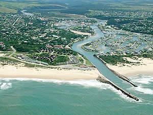 Aerial view of Port Alfred showing on the right the popular marina offering access to both the Kowie River and the ocean as well as a choice waterside lifestyle.  Find Port Alfred accommodation on our Port Alfred accommodation page.