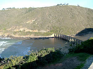 The railway bridge over the Kaaimans River at Wilderness.  The line used to link George with Knysna and was used   by the Outeniqua Choo Tjoe which was the last remaining continually-operated passenger steam train in Africa   until it ceased operation in 2009.  Find Wilderness accommodation on our Wilderness accommodation page.